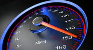 A speedometer showing 150 mph, an excessive speed