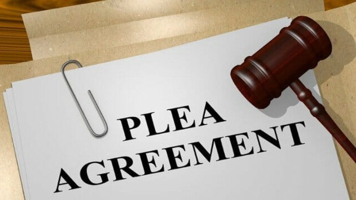 Plea agreement document with a gavel, symbolizing legal processes related to expungement and criminal defense in Texas.