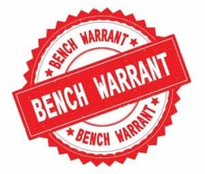 red seal that reads bench warrant