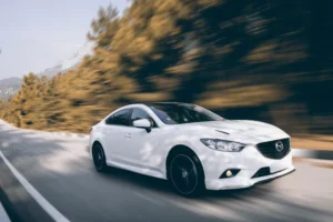 White Mazda, potentially engaging in criminal speeding